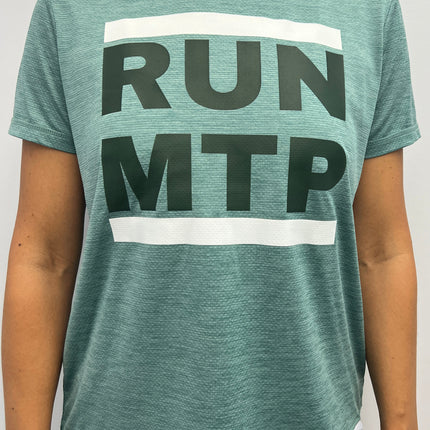Person wearing a green t-shirt with 'RUN MTP' text on a plain background