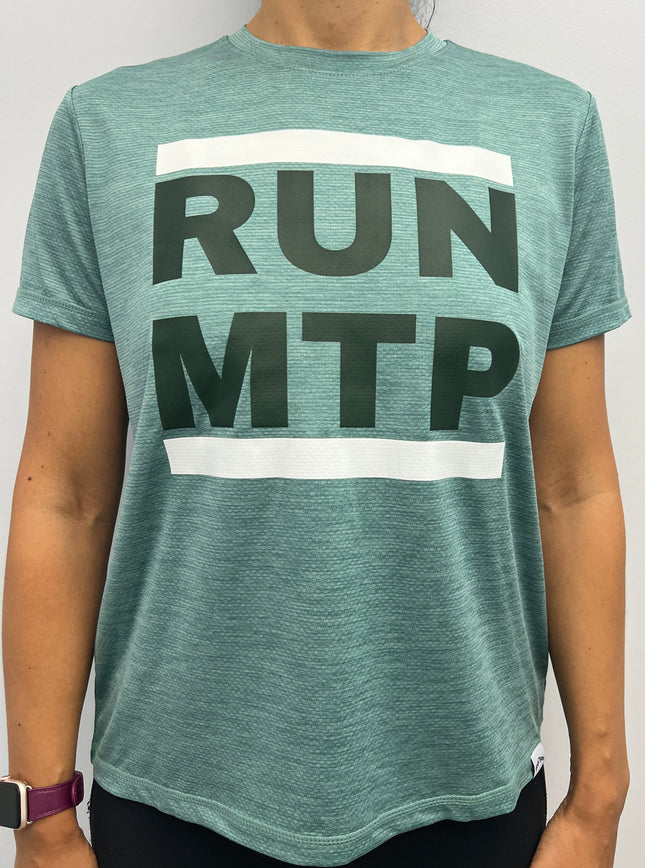 Person wearing a green t-shirt with 'RUN MTP' text on a plain background