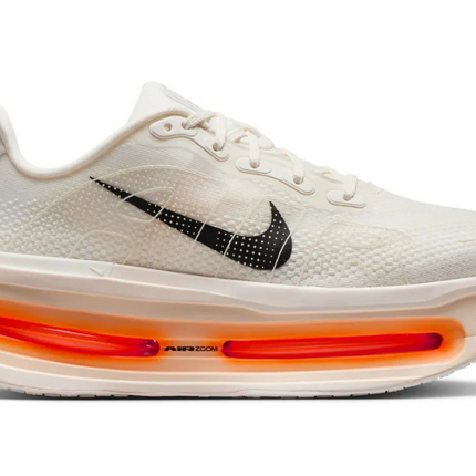 White sneaker with orange air sole on a white background