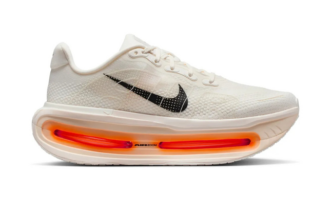 White sneaker with orange air sole on a white background