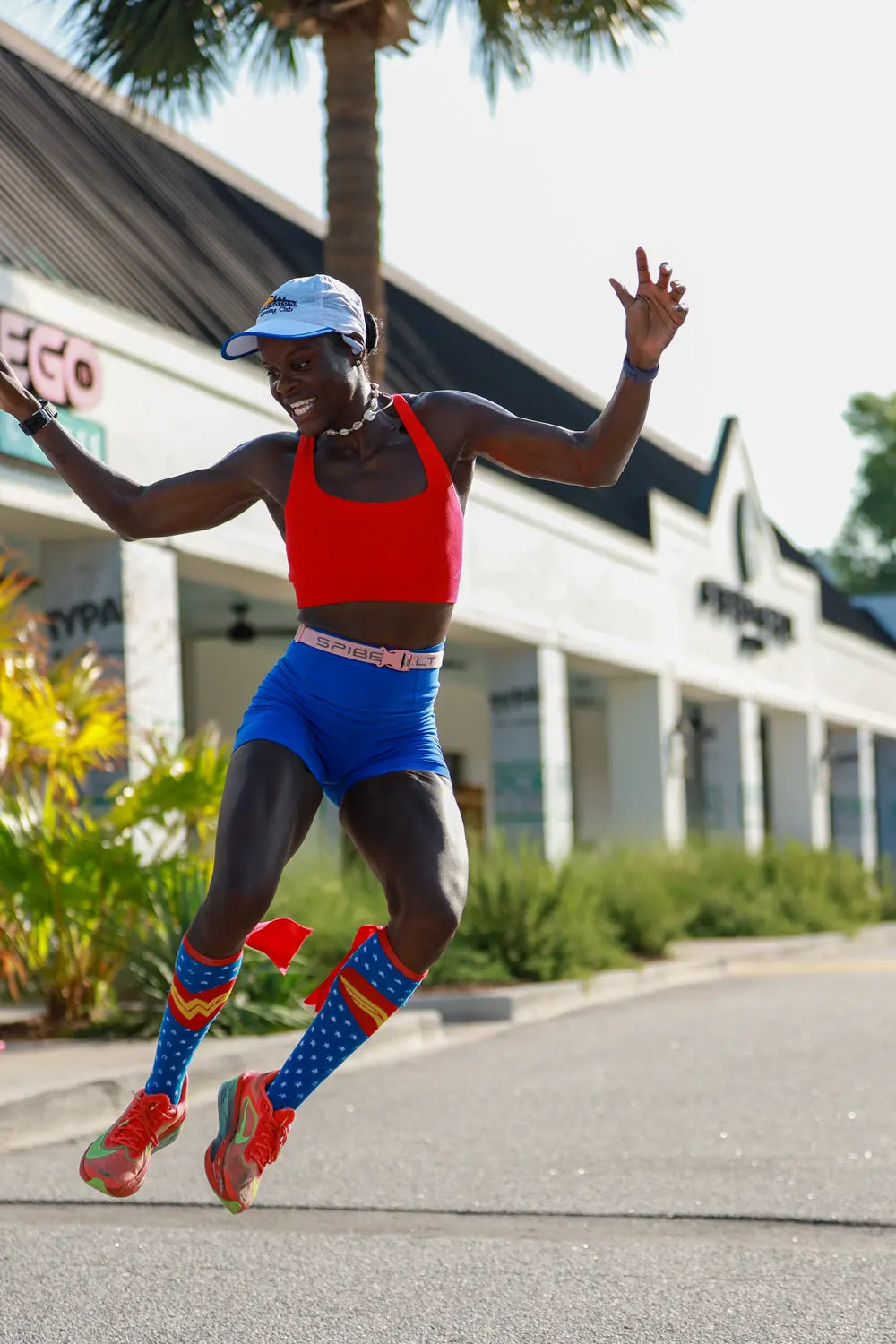 Runner jumping in celebration while finishing a race