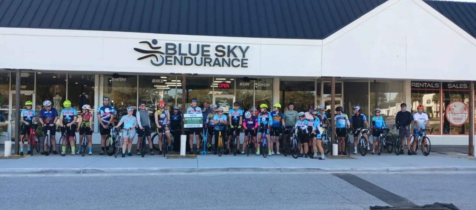 Cyclists lined up outside Blue Sky Endurance on Coleman Blvd before the Tuesday Night Island Busters group ride